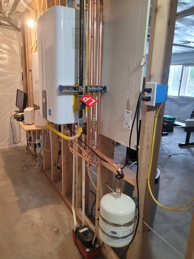 Licensed plumber repairing a kitchen sink in Macomb